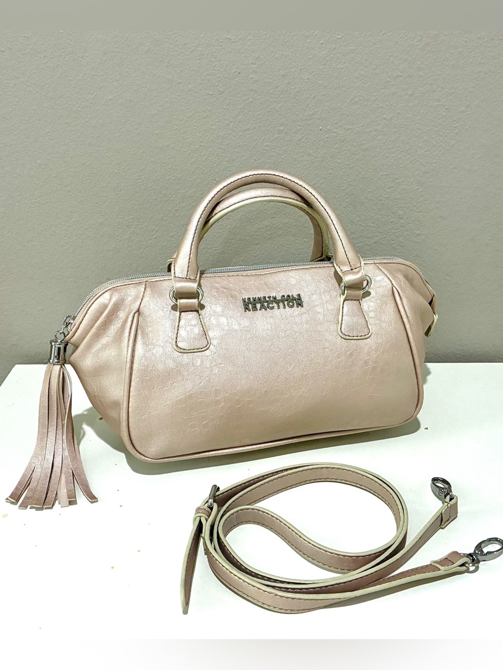 Kenneth Cole Reaction Satchel in light pearlescent pink, with crossbody strap
